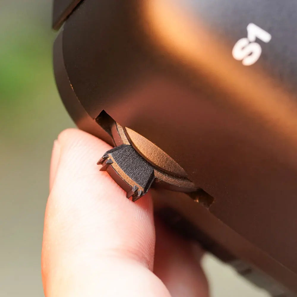 Close-up of a finger operating the RadioMaster TX12 MKII S1 control