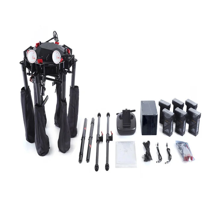 Folded DJI Matrice 600 Pro with controller, batteries, cables and accessories arranged beside it