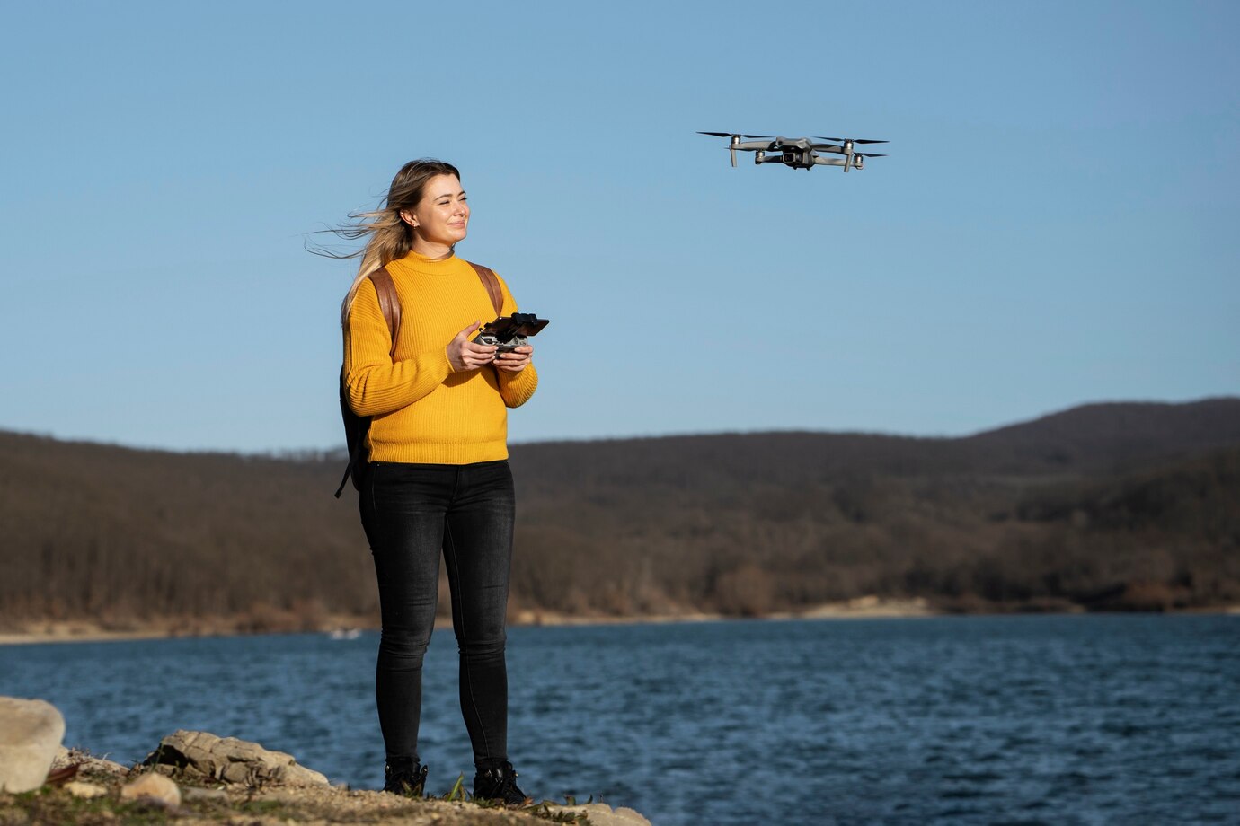 Sarah M. flying her drone outdoors